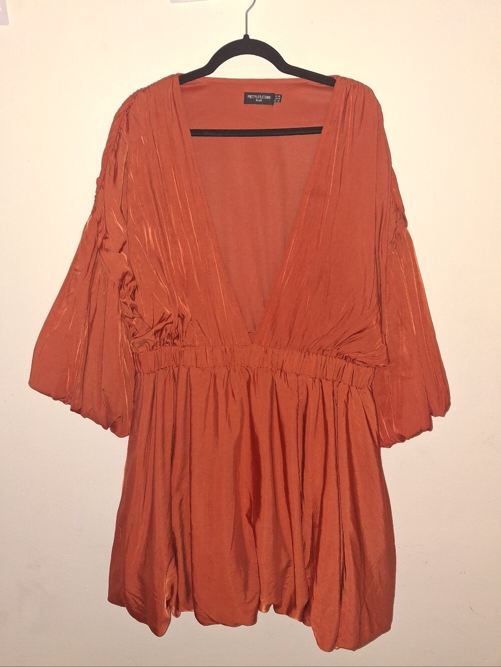 Pretty Little Thing Burnt Orange Deep V Puff Ball Mini dress.